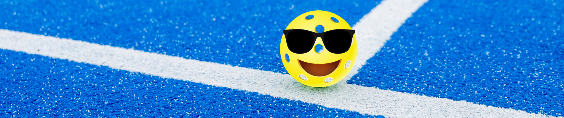 green pickleball ball in a pickleball court, new racket sport co